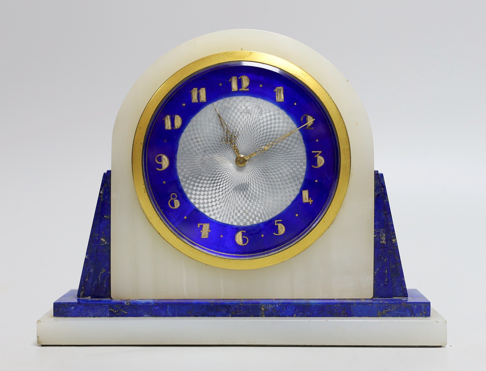 An Art Deco onyx and lapis lazuli cased lever escapement mantel clock, 15cms high